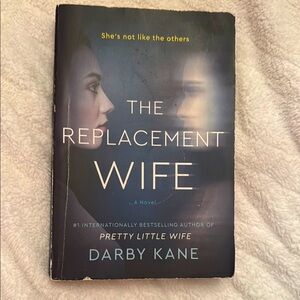 The Replacement Wife by Darby Kane. 📕